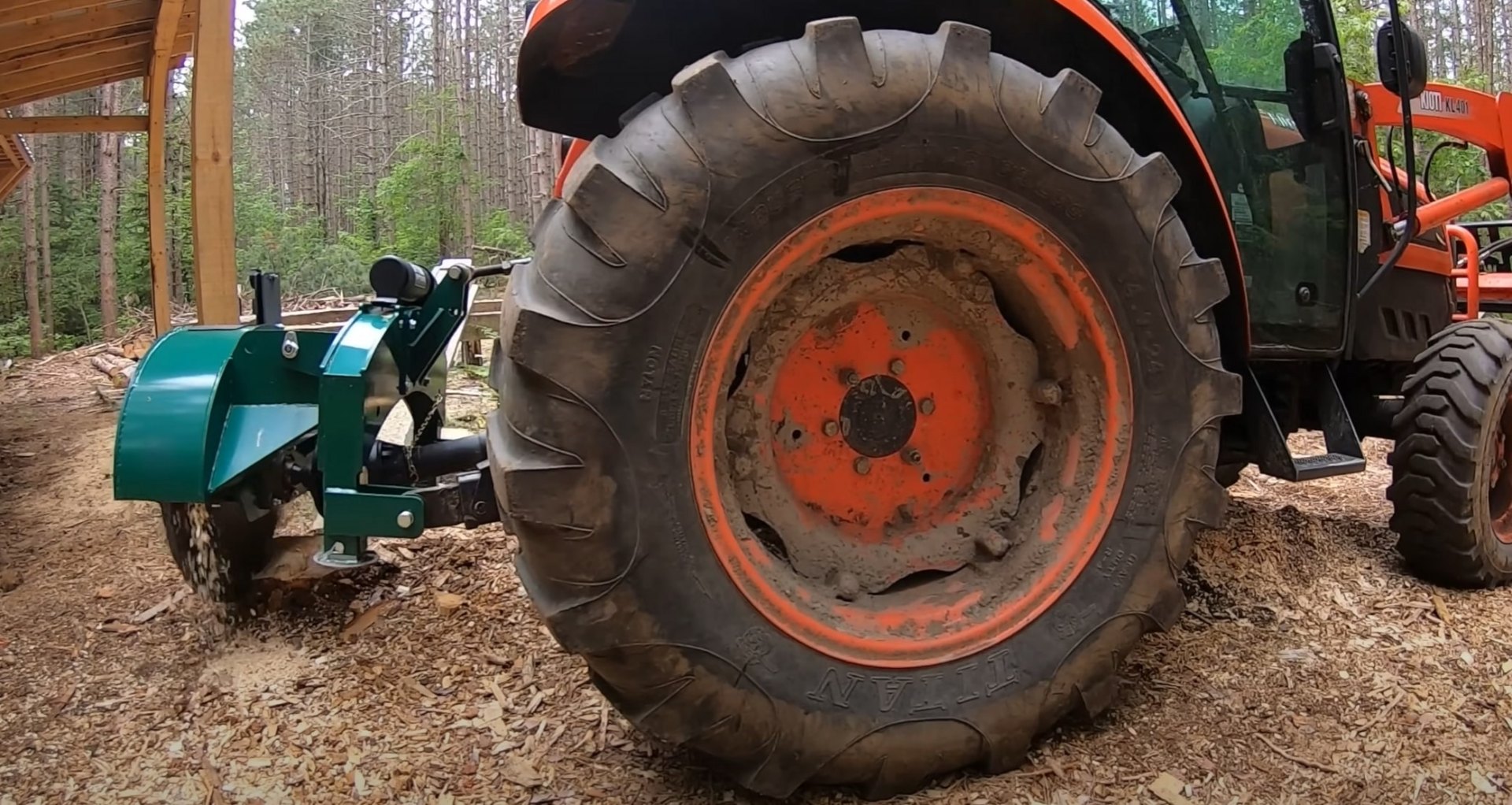 Heavy duty tree service tractor and stump grinding equipment in action